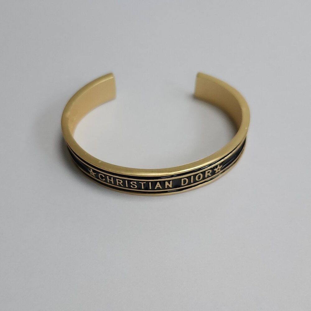 Cuff bracelet with black border highlights open ended. brand new without tags. - Picture 2 of 4